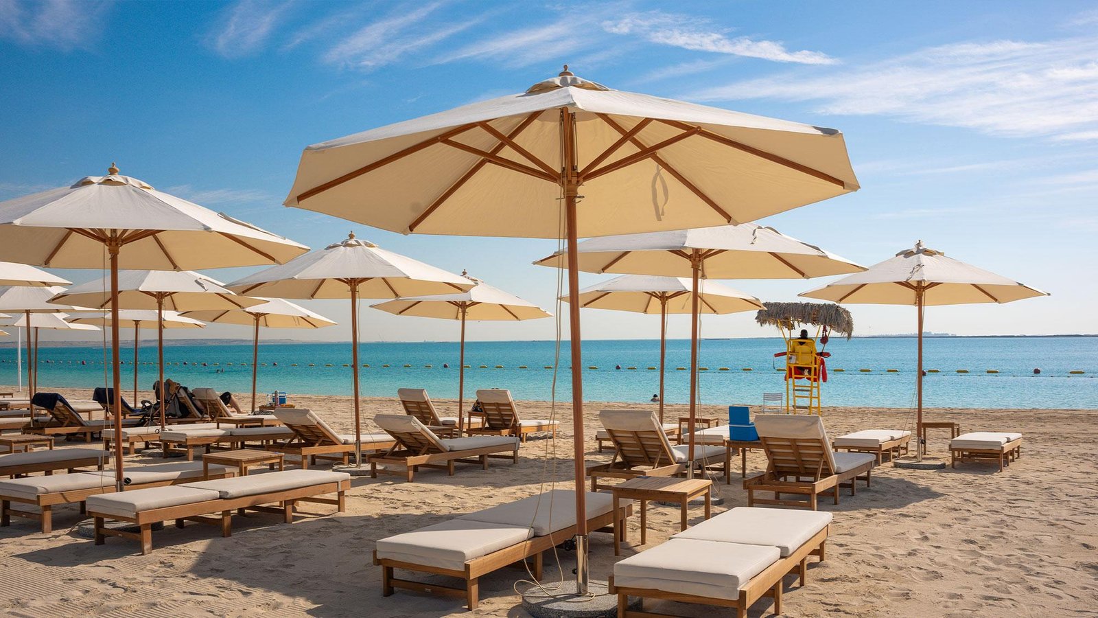 Pristine white sandy beaches and turquoise shores on Hudayriyat Island.